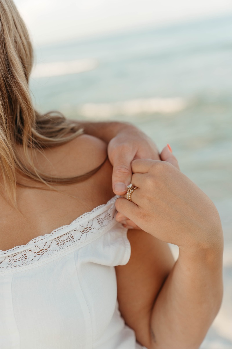 Close up of hands resting on a baby bump